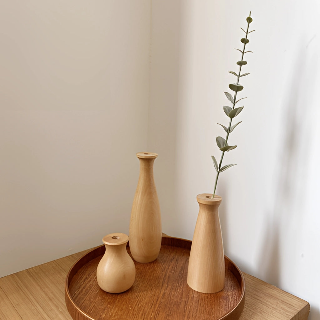 Tall wooden decor vase with natural twig design displayed on a table.