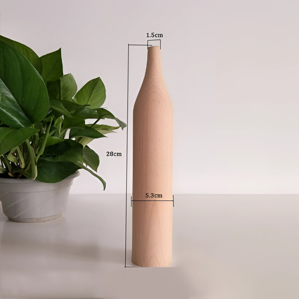 A tall wooden decor vase with a cylindrical shape, displayed with houseplants.