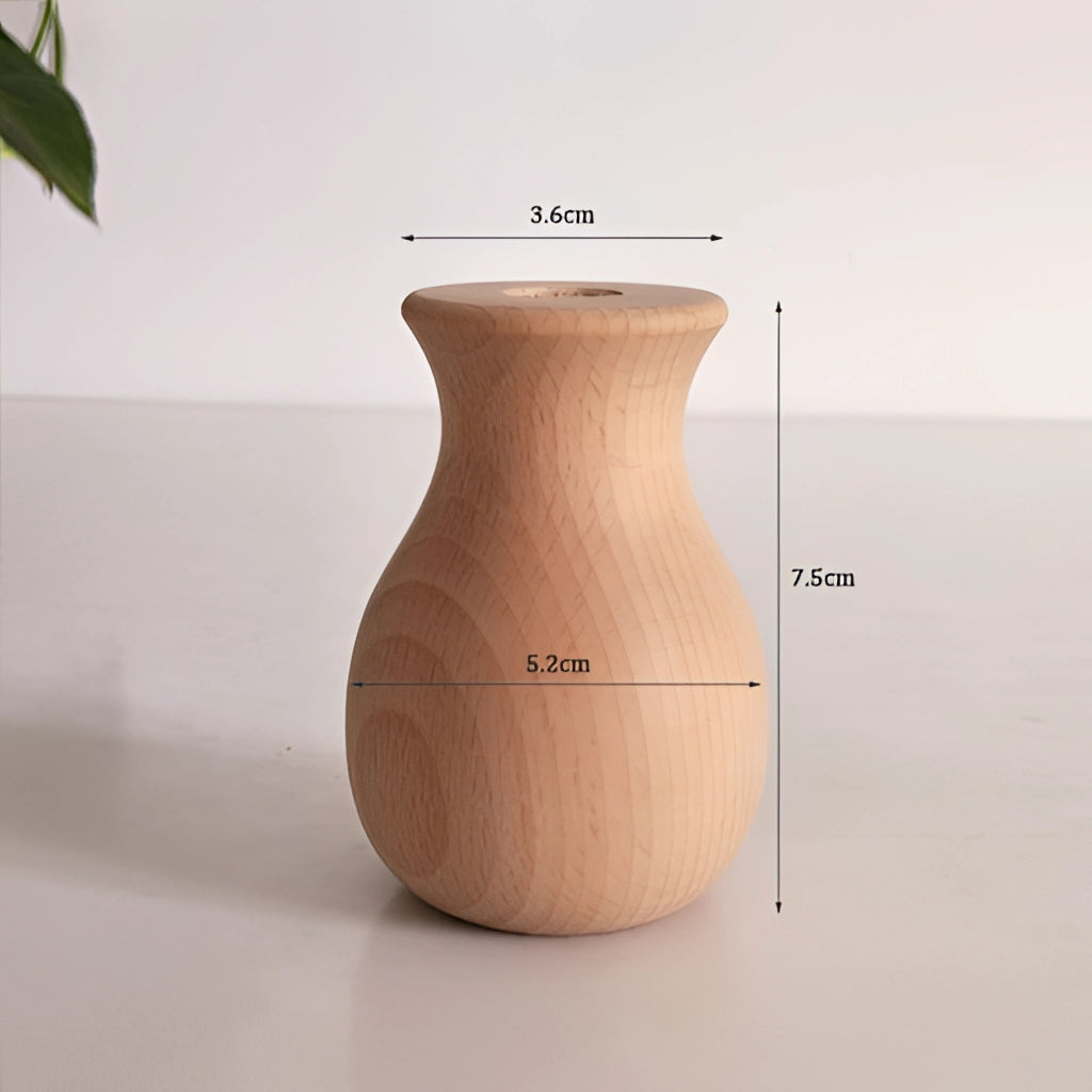 A tall wooden decor vase placed on a table displaying its natural wood grain and elegant design.